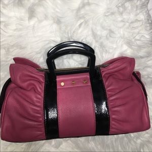 B. Makowsky pink and black purse